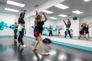A bunch of people learning dance inside a room.